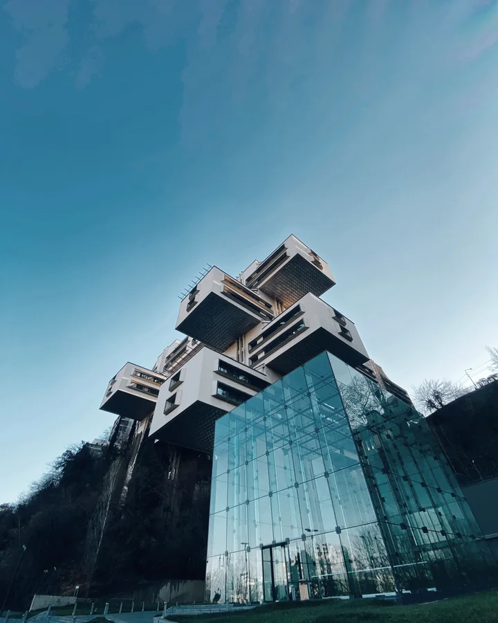 The Bank of Georgia headquarters in Tbilisi, stacked concrete blocks above a glass atrium
