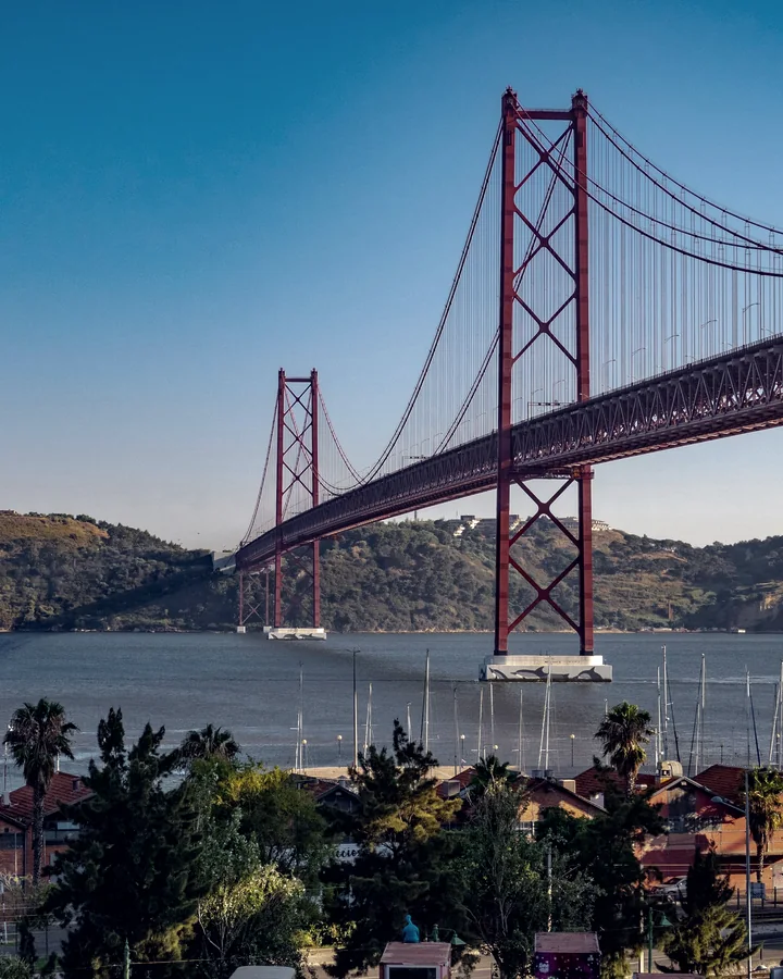 The 25 de Abril Bridge across the Tagus in Lisbon, with the Cristo Rei statue on the far bank