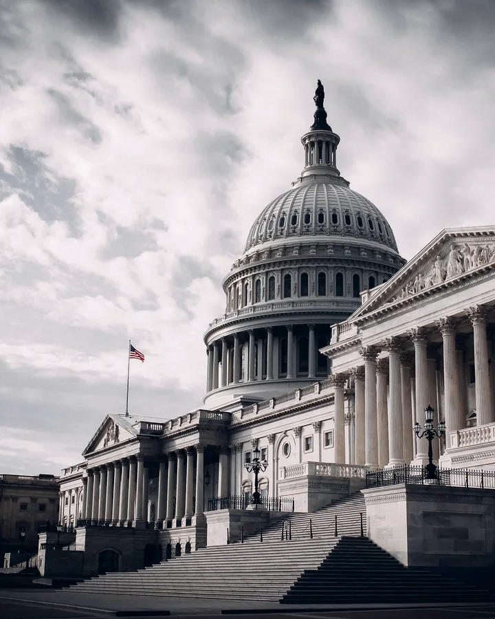 The United States Capitol in Washington, DC, under heavy cloud